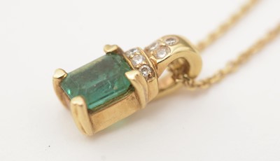 Lot 166 - An emerald and diamond pendant on chain
