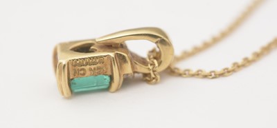Lot 166 - An emerald and diamond pendant on chain