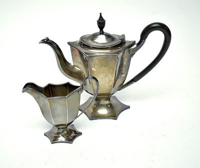 Lot 159 - A silver coffee pot and cream jug by William Hutton & Sons