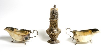 Lot 180 - A pair of silver sauce boats and a silver sugar caster