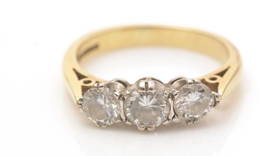 Lot 697 - A three stone diamond ring