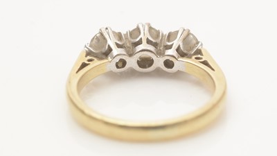 Lot 697 - A three stone diamond ring
