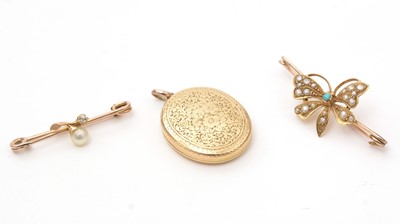 Lot 138 - Two Victorian brooches and a locket pendant