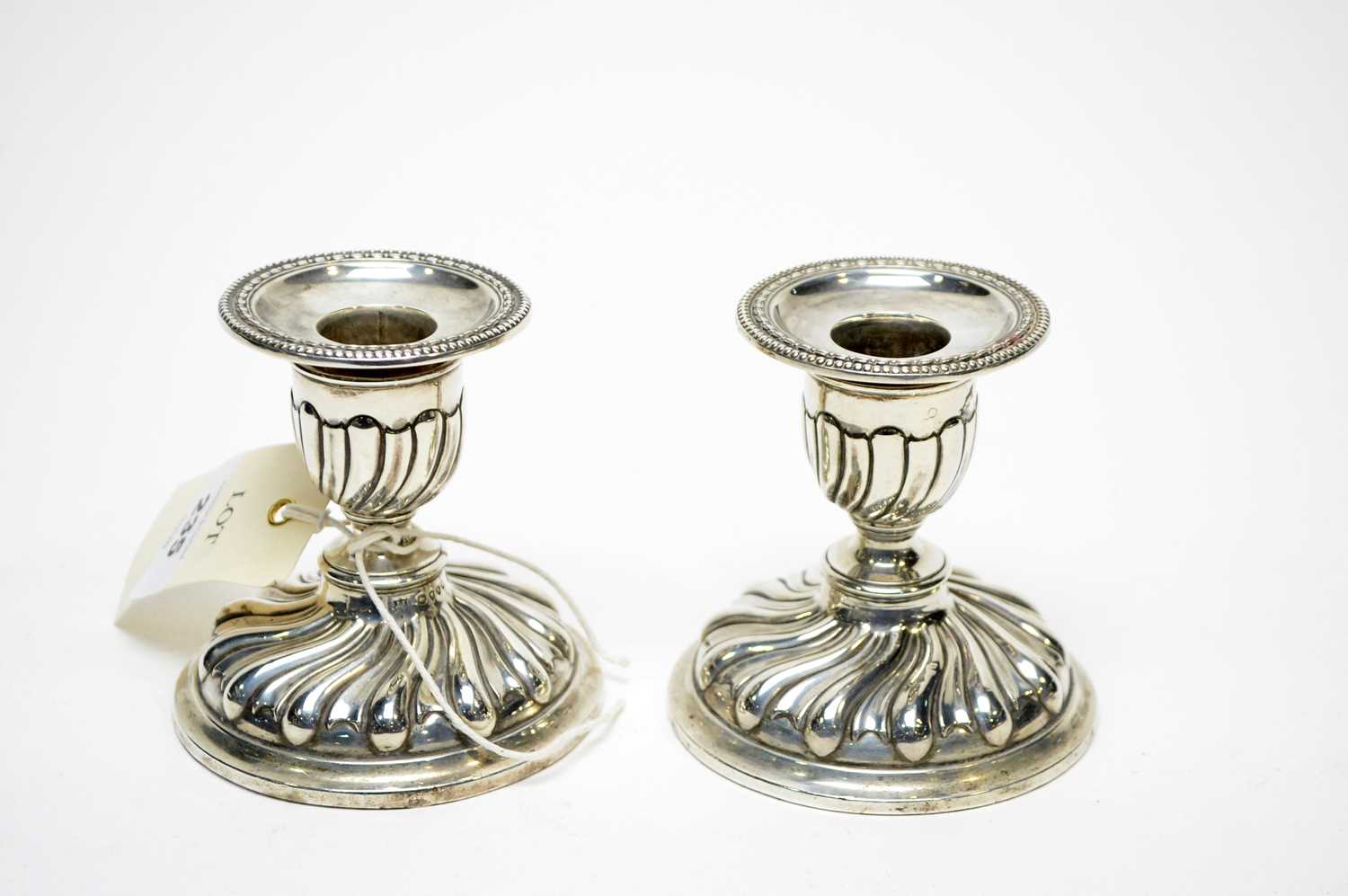 Lot 235 - A pair of Victorian silver candlesticks