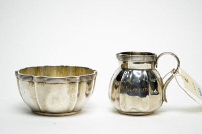 Lot 233 - An Edwardian silver cream jug and sugar bowl, by Reid & Sons