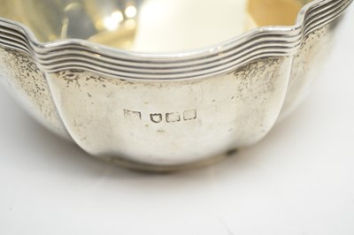Lot 233 - An Edwardian silver cream jug and sugar bowl, by Reid & Sons