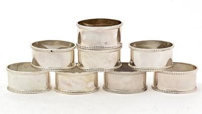 Lot 33 - A set of eight Elizabeth II silver napkin rings