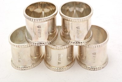 Lot 33 - A set of eight Elizabeth II silver napkin rings