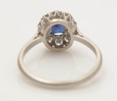 Lot 660 - A sapphire and diamond cluster ring