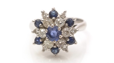 Lot 661 - A sapphire and diamond cluster ring