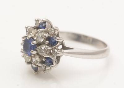 Lot 661 - A sapphire and diamond cluster ring