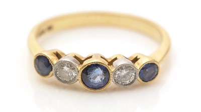 Lot 666 - A sapphire and diamond ring