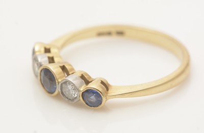 Lot 666 - A sapphire and diamond ring