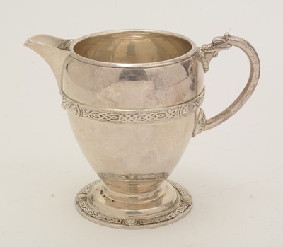 Lot 34 - A George V silver teapot and matching milk jug