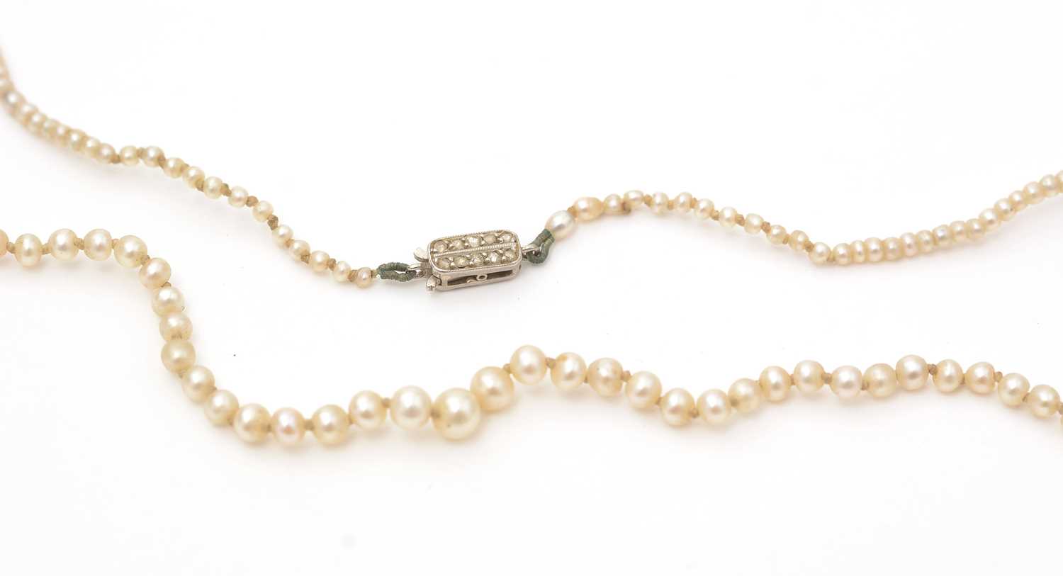 Lot 154 - A single-strand seed pearl necklace with diamond clasp