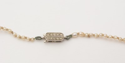 Lot 154 - A single-strand seed pearl necklace with diamond clasp