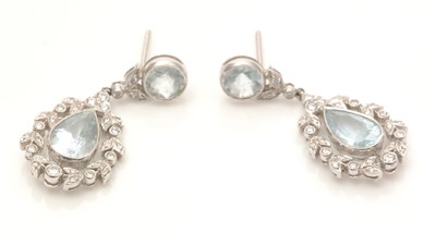 Lot 785 - A pair of aquamarine and diamond drop earrings