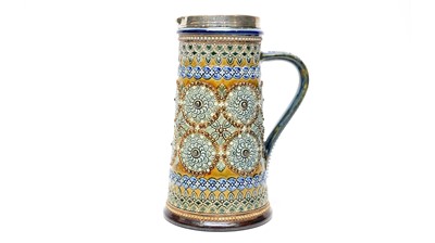 Lot 900 - Doulton Lambeth silver mounted claret jug