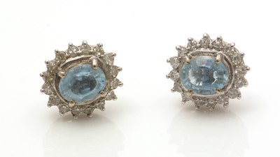 Lot 503 - A pair of aquamarine and diamond cluster earrings