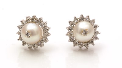 Lot 712 - A pair of cultured pearl and diamond cluster earrings