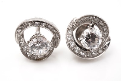 Lot 713 - A pair of white stone and diamond earrings