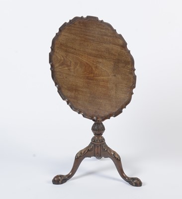 Lot 1490 - A George III style well-carved mahogany tilt-action table