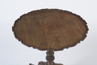 Lot 1490 - A George III style well-carved mahogany tilt-action table