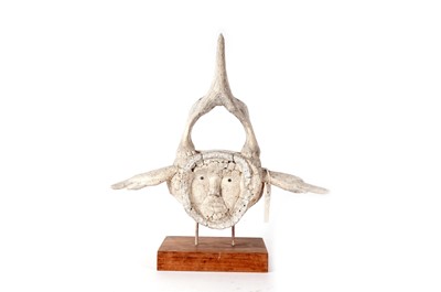Lot 902 - An Inuit whalebone style vertebrae carving
