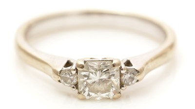 Lot 787 - A three stone diamond ring
