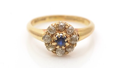 Lot 647 - A sapphire and diamond cluster ring