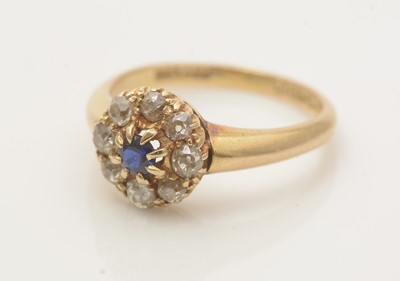 Lot 647 - A sapphire and diamond cluster ring