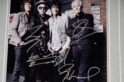 Lot 749 - A signed and framed Rolling Stones photograph