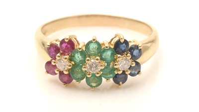 Lot 793 - A ruby, sapphire, emerald and diamond triple cluster ring