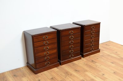 Lot 11 - A set of three reproduction mahogany music cabinets