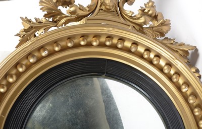 Lot 1308 - A large and decorative Regency gold painted and gesso mirror.