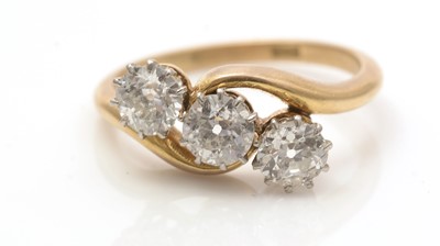 Lot 747 - A three stone diamond ring