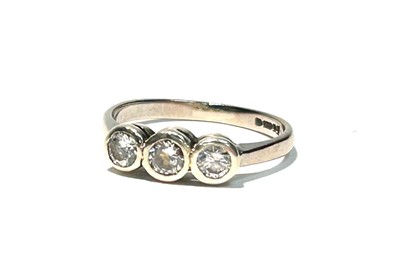 Lot 145 - A three stoned diamond ring