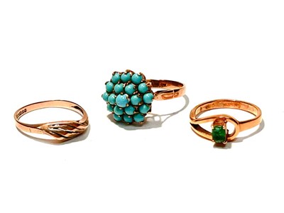 Lot 154 - An emerald ring, a turquoise ring and another
