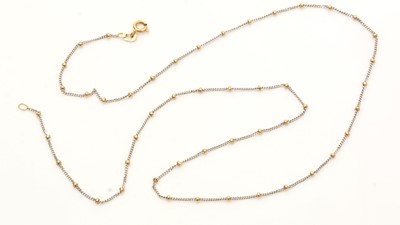 Lot 799 - An 18ct yellow and white gold chain necklace