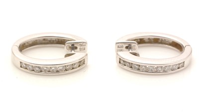 Lot 800 - A pair of diamond earrings