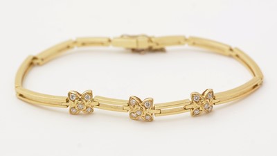 Lot 132 - A diamond and yellow gold bracelet