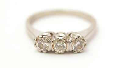 Lot 142 - A three stone diamond ring