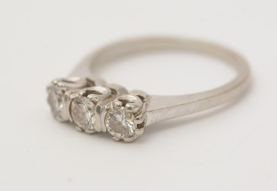 Lot 142 - A three stone diamond ring