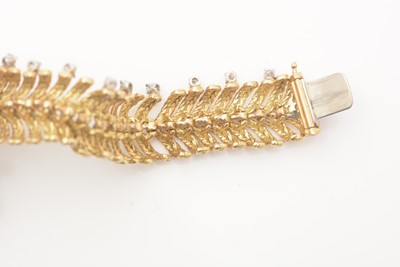 Lot 808 - A fine gold and diamond bracelet