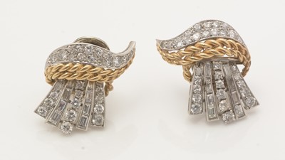 Lot 809 - A gold and diamond brooch and matching earrings