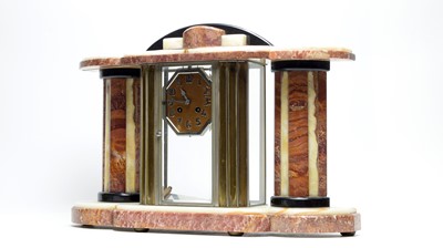 Lot 1248 - A French Art Deco cream and brown veined marble four glass mantel clock