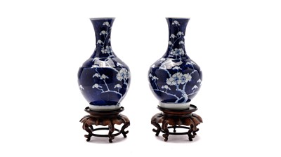 Lot 764 - Pair of Chinese prunus blossom vases and stands