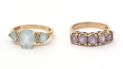 Lot 148 - A topaz and diamond dress ring; and an amethyst ring
