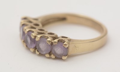 Lot 148 - A topaz and diamond dress ring; and an amethyst ring