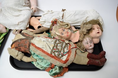 Lot 387 - A collection of antique dolls, doll parts and accessories